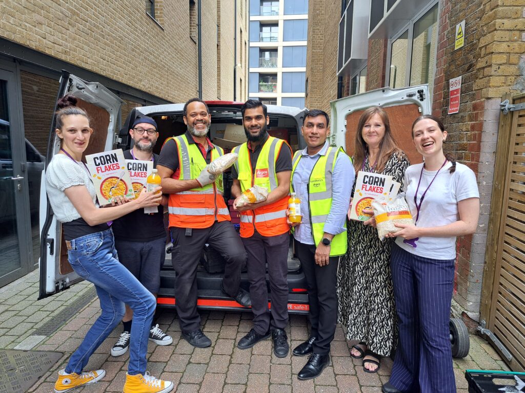 St Luke's staff taking delivery of donated food from Sainsbury's.